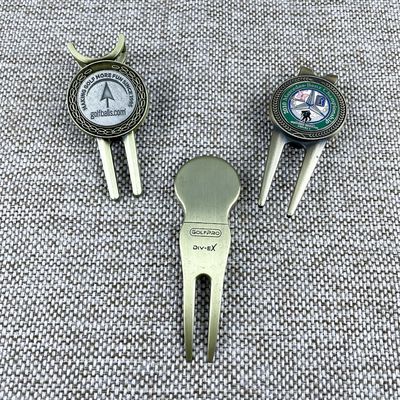 kopen Antieke gouden zachte glazuurgolfschermen en balmarker met magneet online vervaardiging